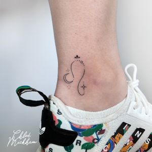 Elegant fine line tattoo featuring a moon, star, and Leo zodiac motif, beautifully crafted by Chloe Mickham.