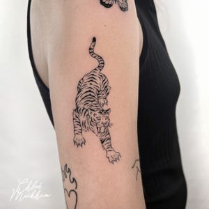 Get mesmerized by this fine line illustrative tiger tattoo, expertly done by Chloe Mickham. A fierce and stunning addition to your body art collection.