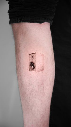 Get a stunning micro_realism tattoo of a stereo speaker and boombox by the talented artist Viola. Perfect for music lovers!