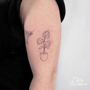 Exquisitely crafted tattoo by Chloe Mickham featuring a montera leaf, vase, and martini glass, creating a delicate and sophisticated design.