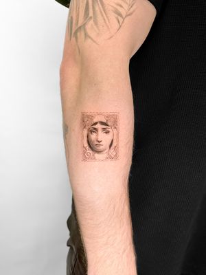 Beautiful tattoo design featuring a lady with a post stamp motif, done by the talented artist Viola.