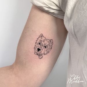 Get a beautiful fine line tattoo of your beloved pet by the talented artist Chloe Mickham. Memorialize your furry friend in a unique and artistic way.