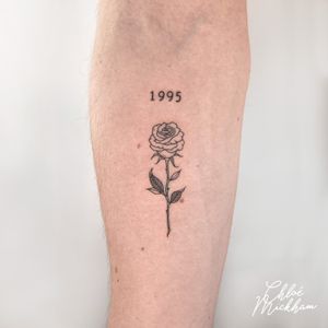 Get a beautifully detailed rose tattoo done in fine line style by the talented artist Chloe Mickham.