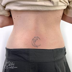 Capture the ethereal beauty of a moonlit night with this delicate fine line tattoo by Chloe Mickham.