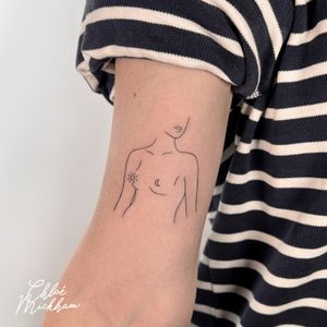 Admire Chloe Mickham's delicate depiction of a woman in this illustrative fine-line tattoo.