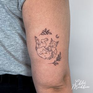 Elegantly detailed fine line cat tattoo by Chloe Mickham, blending illustrative style with delicate intricacy.