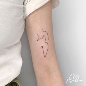 Beautiful single line tattoo by Chloe Mickham featuring a unique abstract cubist design of a woman