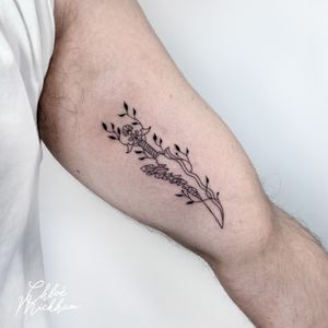 Get a sleek and detailed dagger tattoo done in fine line style by tattoo artist Chloe Mickham to add a unique edge to your look.