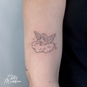 Experience the delicate beauty of a fine line, illustrative angel tattoo designed by the talented Chloe Mickham.