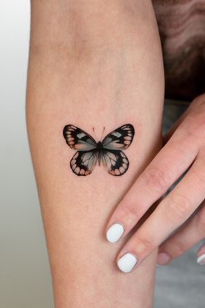 Get mesmerized by Viola's intricate butterfly design, executed with precision and attention to detail. Elevate your ink game with this stunning micro realism artwork.