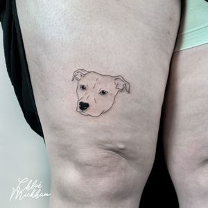 Get a fine line tattoo of your beloved pet from tattoo artist Chloe Mickham. Simple yet meaningful design.
