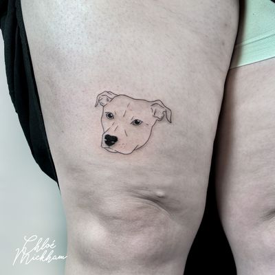 Get a fine line tattoo of your beloved pet from tattoo artist Chloe Mickham. Simple yet meaningful design.