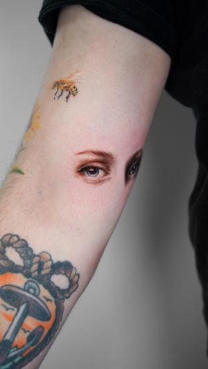 Get lost in the mesmerizing detail of Viola's colorful micro-realism eyes tattoo. Bring a unique and captivating look to your body art.