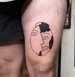Ignorant style blackwork tattoo of man and woman's eyes on upper leg by Ermis Atzemoglou.