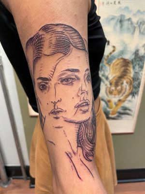 Get mesmerized by this surreal fine line tattoo of a woman on your arm, brought to life by the talented artist Ermis Atzemoglou. Embrace the beauty of surrealism!