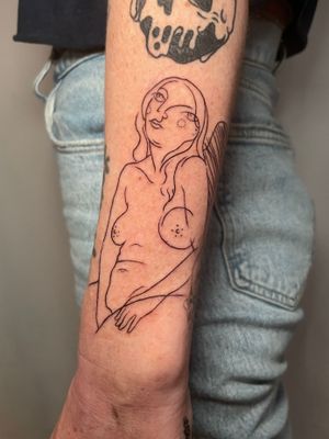 Elegant and unique fine line tattoo of a woman on the forearm, done by talented artist Ermis Atzemoglou.