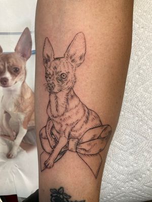 Capture your furry friend with a stunning fine line portrait tattoo on your forearm by the talented artist Ermis Atzemoglou.