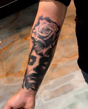 Black and grey Rose and Face by Michael Ascarie @michaelascarietattoos