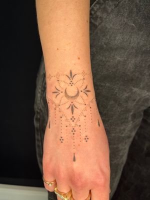 Elegant hand-poked pattern tattoo by Indigo Forever Tattoos. A unique blend of dotwork and ornamental style.