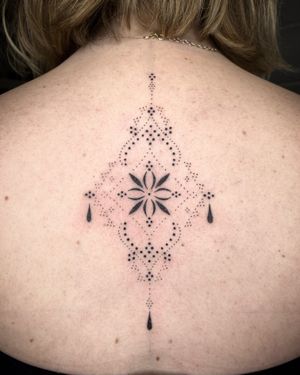 Elegant ornamental design by Indigo Forever Tattoos, combining intricate flowers and patterns for a unique look.