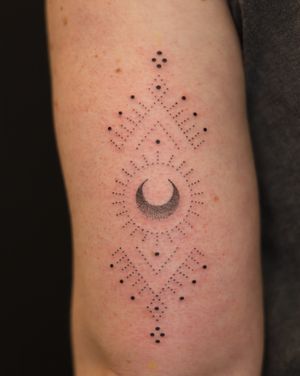 Unique dotwork and hand-poked ornamental design by Indigo Forever Tattoos, featuring a moon motif and intricate patterns.