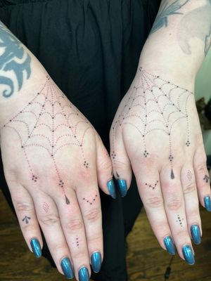 Elegant hand-poked spider and ornamental pattern by Indigo Forever Tattoos. Unique dotwork style for a timeless design.
