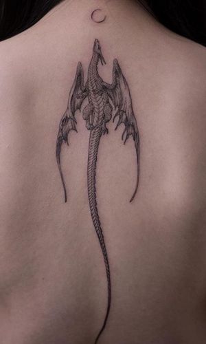 Black and grey dragon spine tattoo 