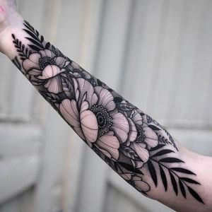 Blackwork floral negative space sleeve