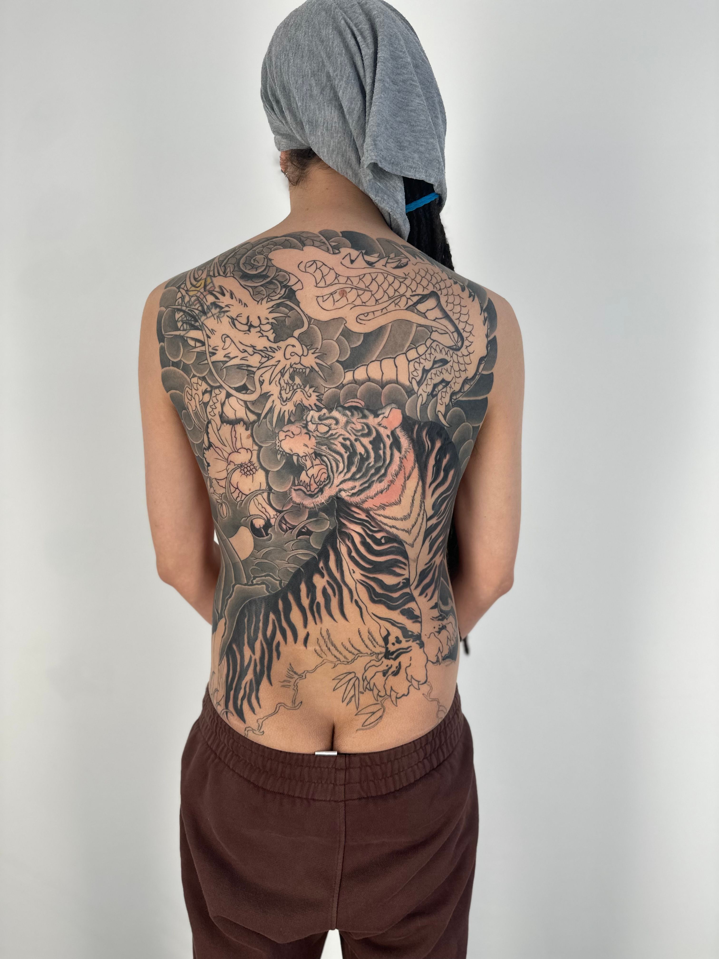 Outline tattoo of a dragon and tiger lily flower on Craiyon