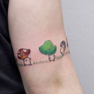 Embrace your love for nature with this fine line mushroom tattoo by artist Nikki Bostin. Perfect for nature lovers!
