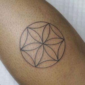 Elegant forearm tattoo by Nikki Bostin featuring intricate mandala design in fine line style.