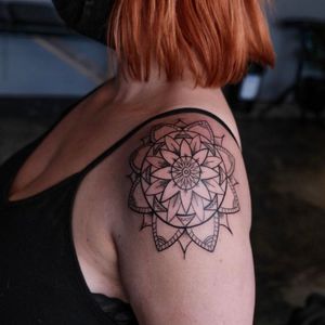 Elegant mandala design by Nikki Bostin, perfect for adding intricate beauty to your upper arm.