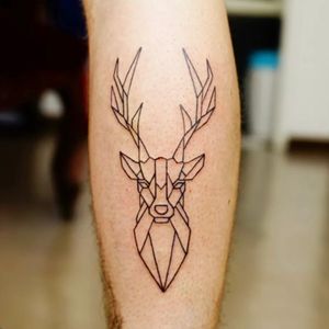 Adorn your lower leg with a stunning fine line, geometric deer tattoo by Nikki Bostin for a unique and elegant look.