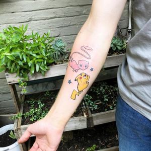 Adorable new school anime style tattoo featuring Pikachu and Mew by tattoo artist Nikki Bostin.