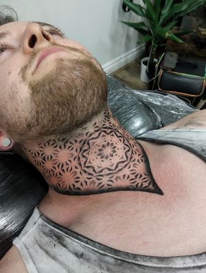 Blackwork tattoo with intricate dotwork designs and geometric elements, meticulously done by the talented artist Giada.