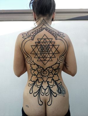 Beautifully designed by Giada, this tattoo blends floral, ornamental, and tribal elements in a stunning blackwork style.