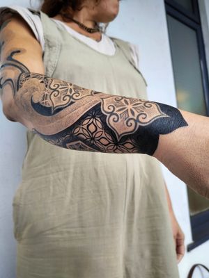 Elegant and intricate blackwork design with geometric and ornamental details, expertly done by the talented artist Giada.