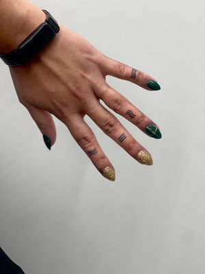Get a mesmerizing fine line pattern tattoo on your finger by the talented Miss Vampira. Embrace the intricate beauty!