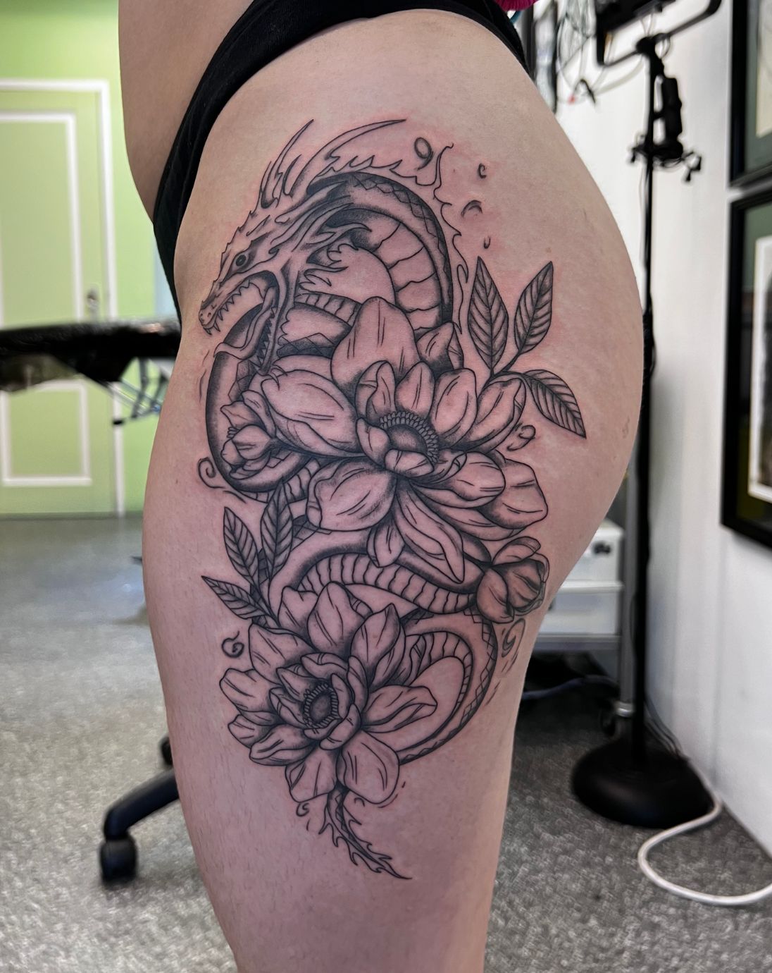 Fierce Dragon with Cherry Blossom Flowers Tattoo - TattooVox Professional  Tattoo Designs Online