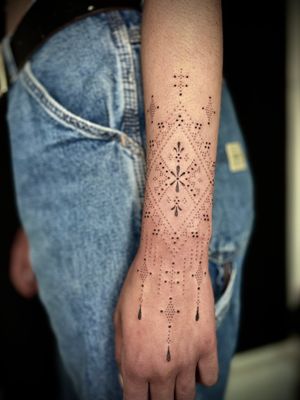 Elegant pattern design by Indigo Forever Tattoos, perfect for a timeless and unique look on your forearm.
