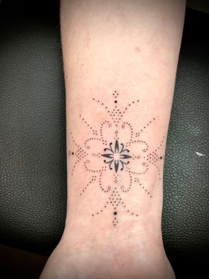 Beautiful forearm tattoo with intricate hand-poked ornamental pattern design by Indigo Forever Tattoos.
