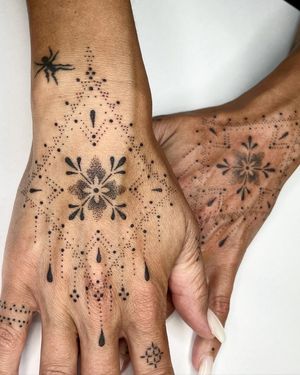 Unique hand-poked ornamental design by Indigo Forever Tattoos, combining delicate flowers and intricate patterns in dotwork style.