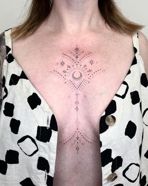 Hand-poked design by Indigo Forever Tattoos combining intricate patterns with a mystical moon motif.