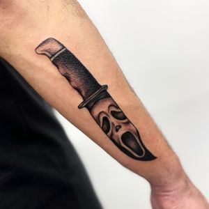 Elegant blackwork knife design by Miss Vampira on the forearm for a bold and edgy look.