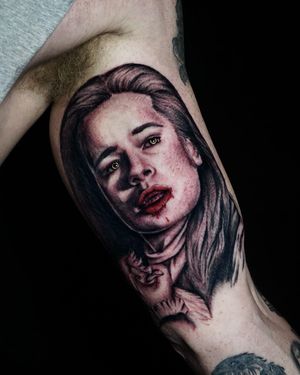Experience the allure of a vampire with this black and gray realism tattoo on your upper arm by the talented Miss Vampira.