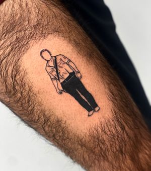 Unique blackwork design of a man on upper leg, expertly executed by tattoo artist Miss Vampira.