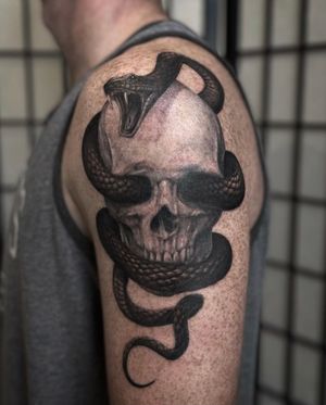 Skull and snake tattoo made by Zach Long at the Bell Rose Tattoo in Daphne, Alabama.