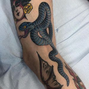 Snake gap filler tattoo made by Robert Johnson at the Bell Rose Tattoo in Daphne, Alabama