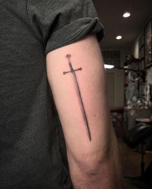 Fine line sword made by Zach Long at the Bell Rose Tattoo in Daphne, Alabama.