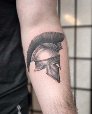 Spartan helmet tattoo made by Zach Long at the Bell Rose Tattoo in Daphne, Alabama.
